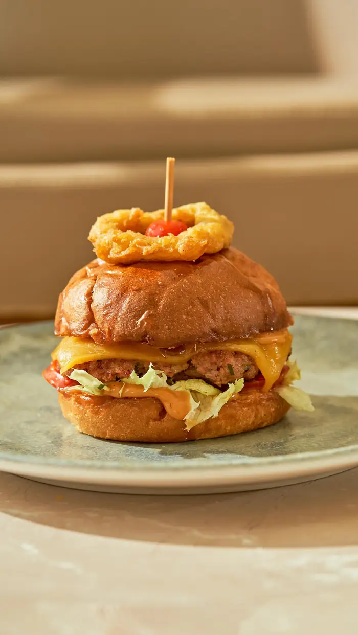 A Cafe Cassia burger with an onion ring