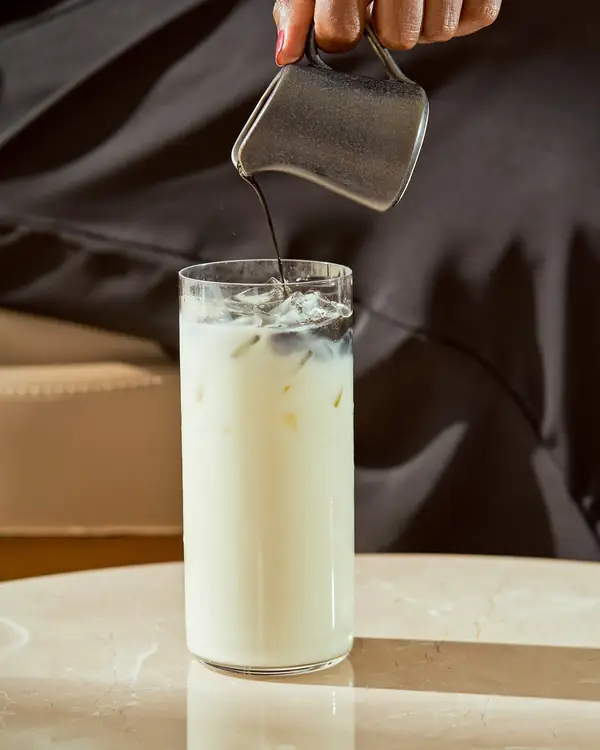 Iced latte being poured