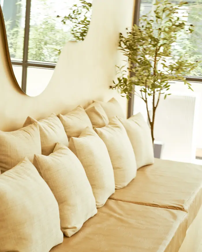 Cushioned banquette inside, by the windows