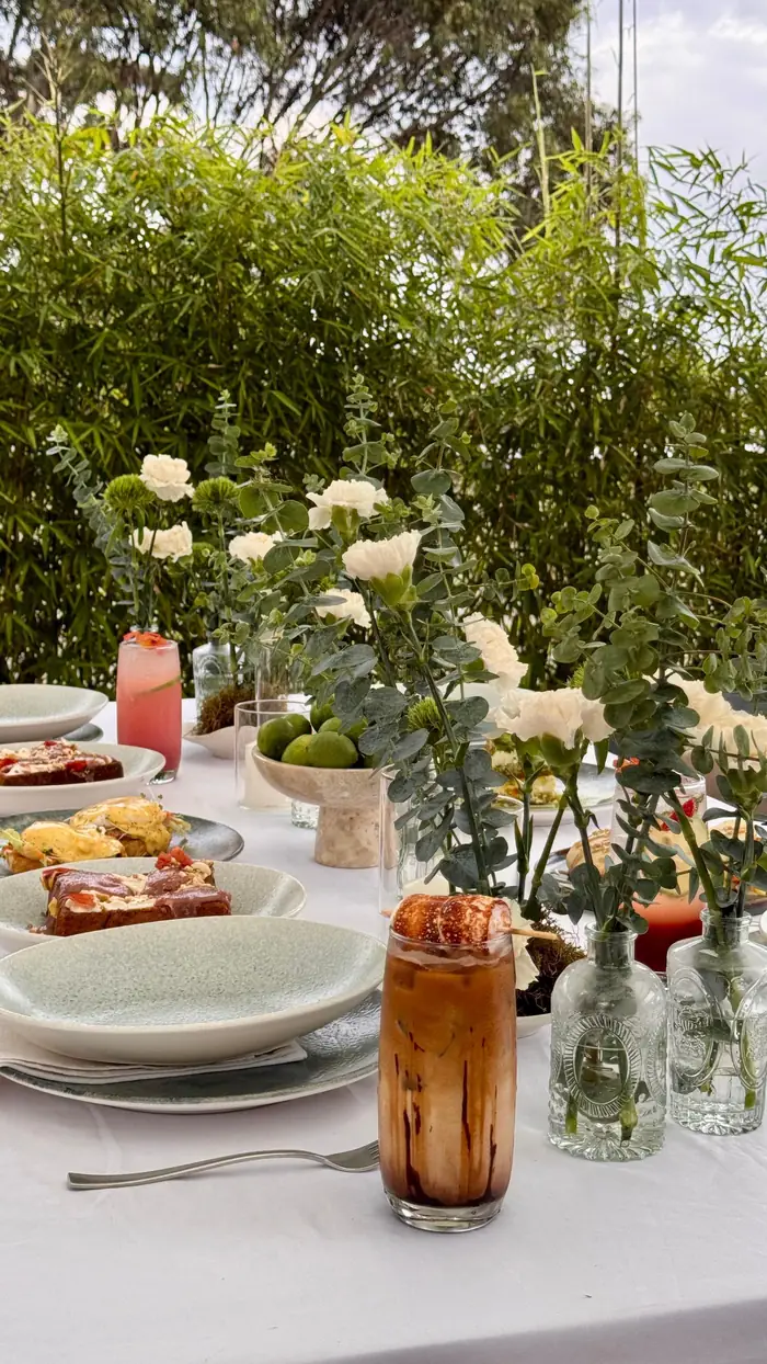 A long table set with white flowers